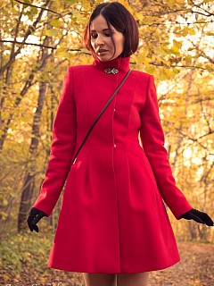 Jeny in an autumn wood takes off her image 1