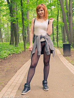 Jeny smith in the park in seamless pantyhose image 1