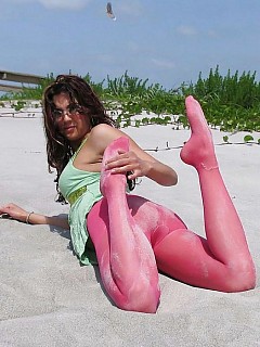 Nasty amateur girls posing outdoor in their colored pantyhose image 6