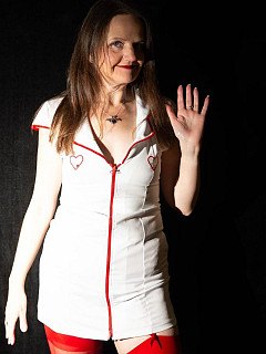 Louise in red stockings and strapon image 2
